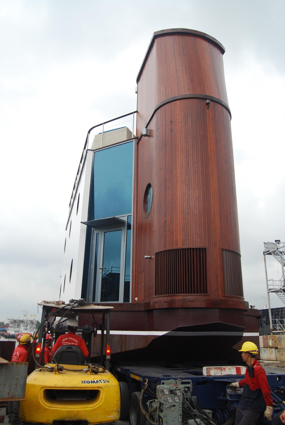 Completed pleasure-barge application being moved on a transport platform