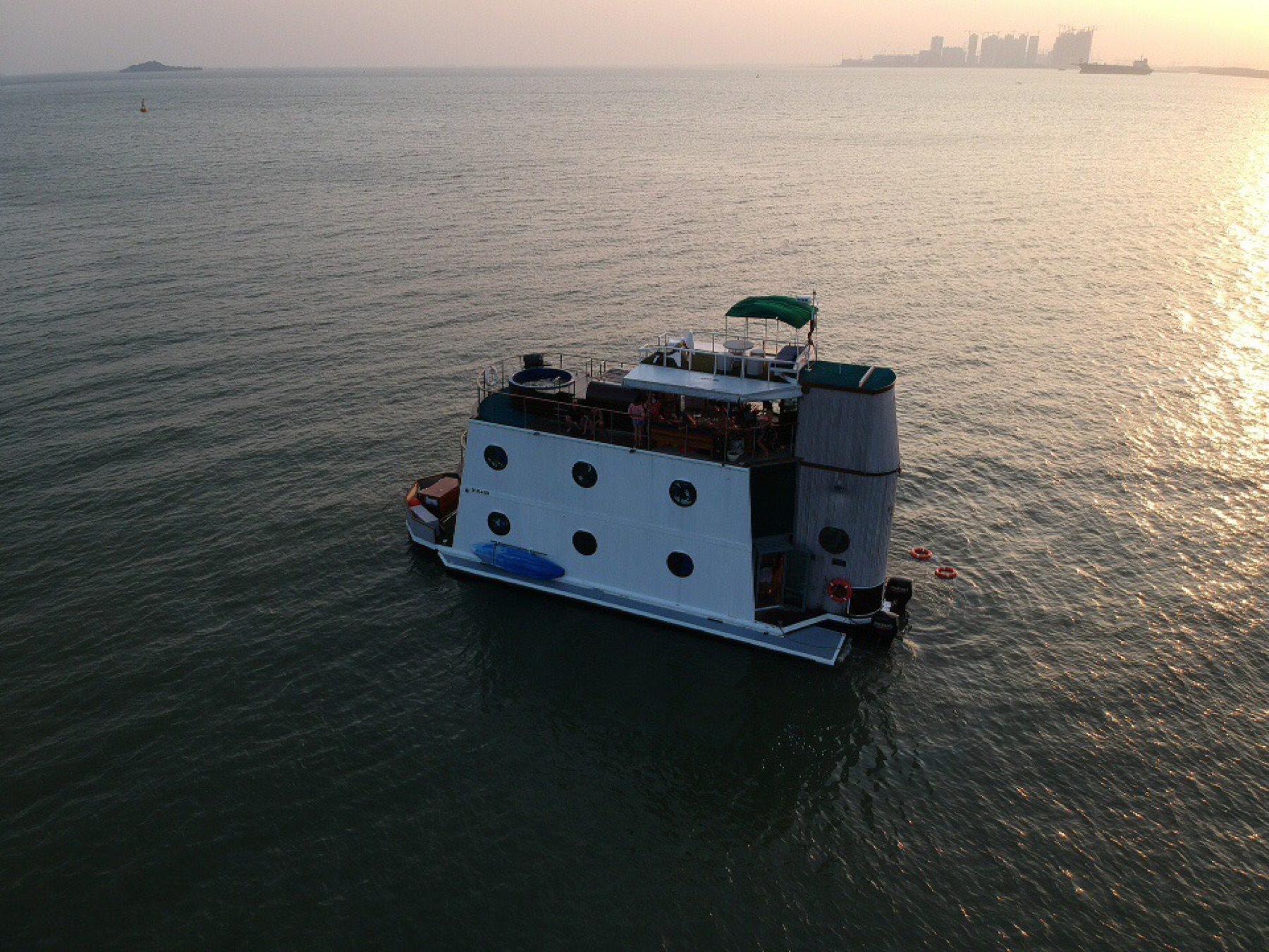 Completed pleasure-barge application from the Nautilus modular steel-hull archive, photographed on the water