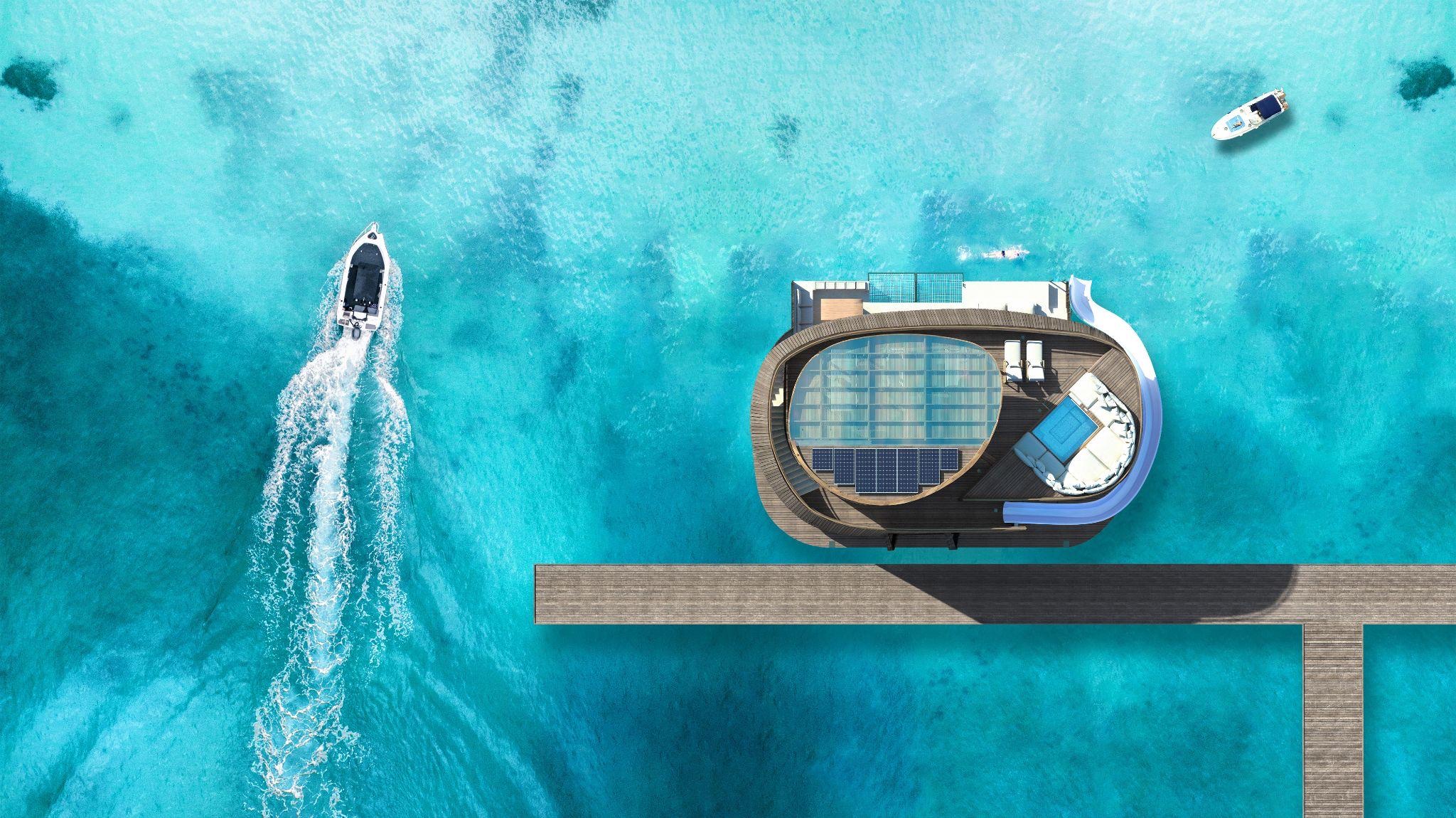 Aerial view of the Turtle Bungalow showing its roof deck, solar panels and water slide