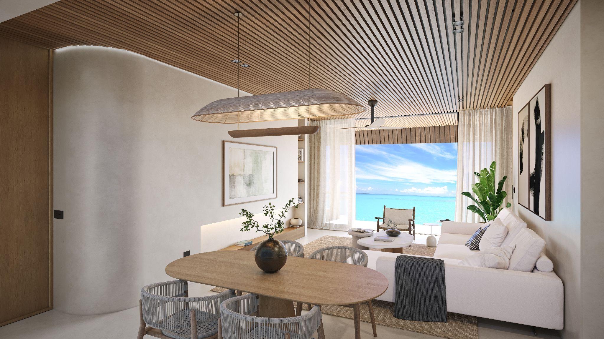 Interior of the Turtle Bungalow with timber ceiling and open view across the lagoon